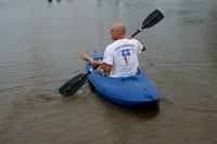 Doug kayaking across FM2094 to get to his marina & boat